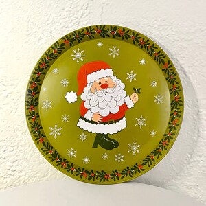 Vintage Mistletoe Santa Clause cookie tray with a snowy and Green background