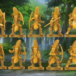 May include: A set of ten yellow miniature figurines, each depicting a humanoid character wearing a banana peel as armor. The figures are posed in various stances, with some holding bows and arrows, standing on individual rectangular bases.
