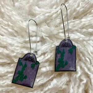 Death’s head motif gravestone earrings