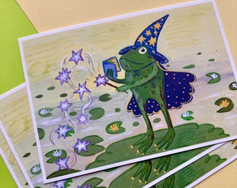 May include: A green frog wearing a blue and gold wizard hat and cape, holding a book and a wand, casting a spell that creates a trail of purple stars over a pond with lily pads.