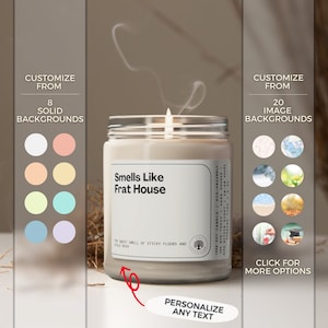May include: A white soy candle with a brown label that reads "Smells Like Frat House" and "The sweet smell of sticky floors and stale beer". The candle is lit and has a white smoke plume rising from it. The candle is surrounded by a white background with a brown border.