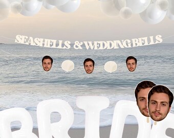 May include: White inflatable letters spelling "BRIDE" on a beach with a banner that reads "Seashells & Wedding Bells". There are white balloons in the background and two photos of a man's face.
