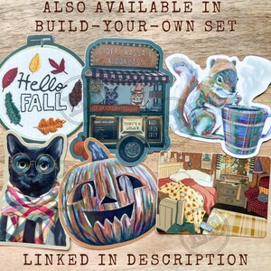May include: A collection of fall-themed stickers, including a cat wearing glasses and a scarf, a squirrel with a mug, and a pumpkin. The stickers have text that says "Hello Fall" and "Cider, Wassail & Donuts".