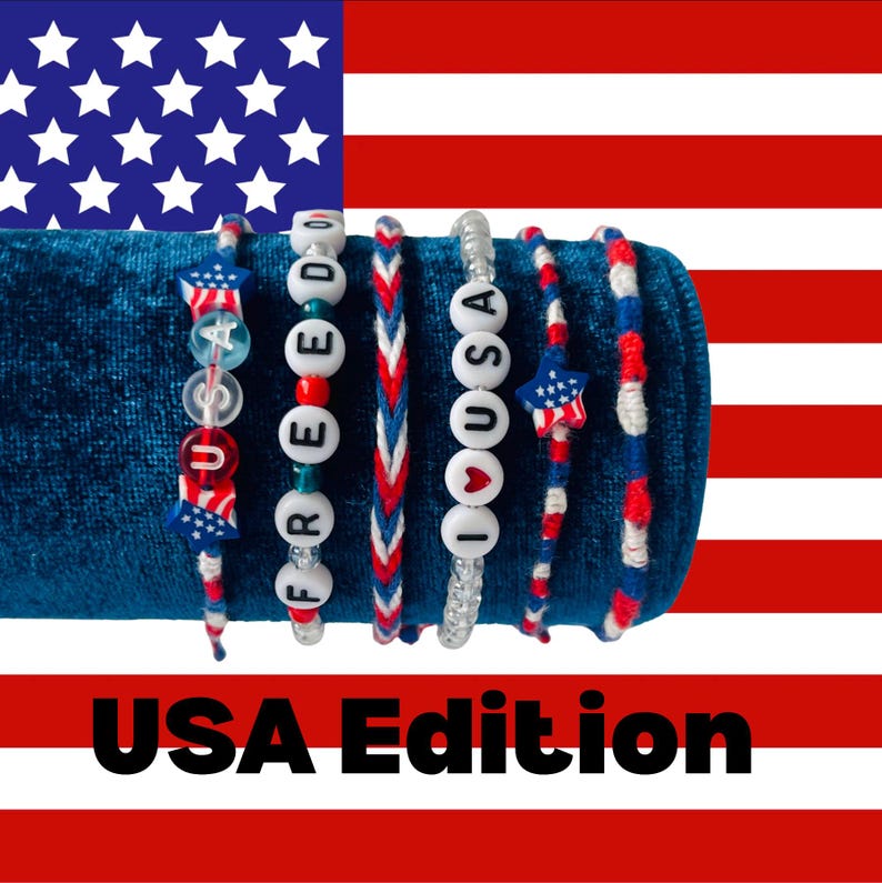 May include: A set of six bracelets featuring red, white, and blue colours. The bracelets include star-shaped beads, letter beads spelling USA, FREEDOM, and I LOVE USA, and braided cord designs. The text USA Edition is displayed at the bottom of the image.