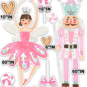 May include: A pink and white ballerina fairy with wings and a crown, holding a lollipop. A pink and white nutcracker with a crown, holding a lollipop. Both figures are 60 inches tall. There are also gingerbread hearts and lollipops in the image.