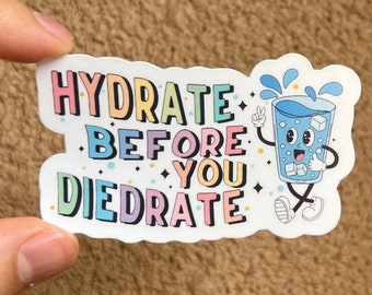 May include: A white sticker with a colorful cartoon glass of water with ice cubes and the text "HYDRATE BEFORE YOU DIEDRATE".