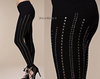 May include: Black leggings with silver rhinestone embellishments in a vertical pattern. "Put a Girl In It" is written in white text on the image.