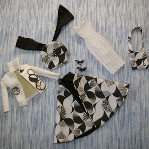Poppy has a ensemble of seven pieces in Black and White.  Outfit for Poppy Parker, Barbie Silkstone, Integrity, Fashion Royalty Dolls