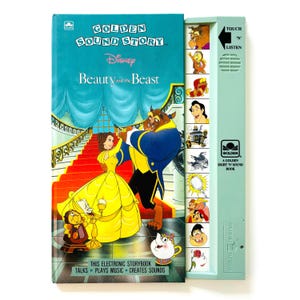May include: A Disney Beauty and the Beast Golden Sound Story book featuring a teal cover with Belle and the Beast dancing on a red staircase. The attached light green sound module includes a speaker, a Touch 'N Listen arrow, and buttons.