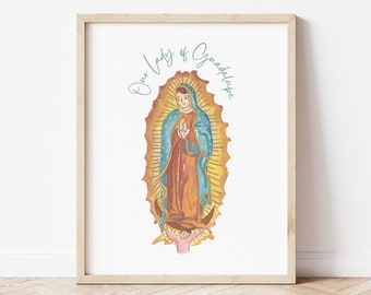 May include: A print of Our Lady of Guadalupe, a religious image of the Virgin Mary, depicted in a blue and gold robe with a crown of stars. The image is set against a white background with the text "Our Lady of Guadalupe" in blue script.