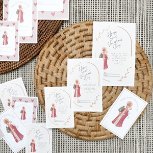 以下が含まれることがあります： 聖バレンタインデーのカードのコレクション。カードには「Happy Saint Valentine's Day」の文字と、「To」と「From」のメッセージスペースがあります。一部のカードにはハート模様があります。