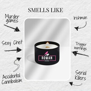 May include: A black candle with a white wax top and a pink logo that says "ROWAN Butcher & Blacksmith" with a black bird and knife graphic. The candle is surrounded by handwritten text that says "Smells Like" and lists various scents, including "Murder games", "Sexy Chef", "Accidental Cannibalism", "Irishman", "Trigger warnings", and "Serial Killers".