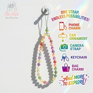 May include: A multi-colored beaded strap featuring smooth, round cat's eye beads in shades of pink, purple, yellow, orange, and green. The text reads: ONE STRAP, ENDLESS POSSIBILITIES! PHONE CHARM, CAR ORNAMENT, CAMERA STRAP, KEYCHAIN, BAG CHARM, And more to explore!