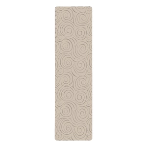 May include: A beige yoga mat with a swirling pattern.
