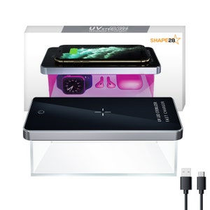 May include: A white box with the text "FOLDABLE UV STERILIZER Wireless Charger" and "SHAPE28" on it. The box shows a black wireless charging pad with a silver trim. The charging pad has a phone, a watch, and earbuds on it. The charging pad is illuminated with a pink light. The charging pad is also shown in a close-up view with a USB cable.