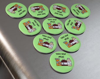 May include: Eight green round refrigerator magnets with the text "Take your meds" and a cartoon image of prescription bottles.
