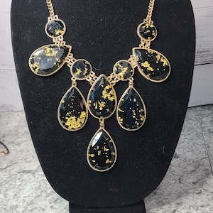 Gold flake statement necklace by Aldo