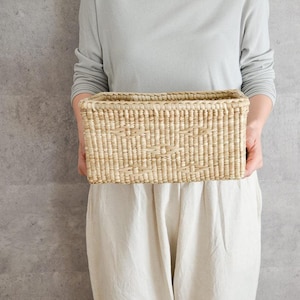 May include: A set of three ceramic mugs with a speckled, matte finish in cream, light grey, and dark grey. Each mug has a simple, minimalist design, suitable for coffee or tea.