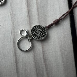 Secure and easy-to-attach lobster clasp and ring – designed for dreadlocks, braids, and loose hair