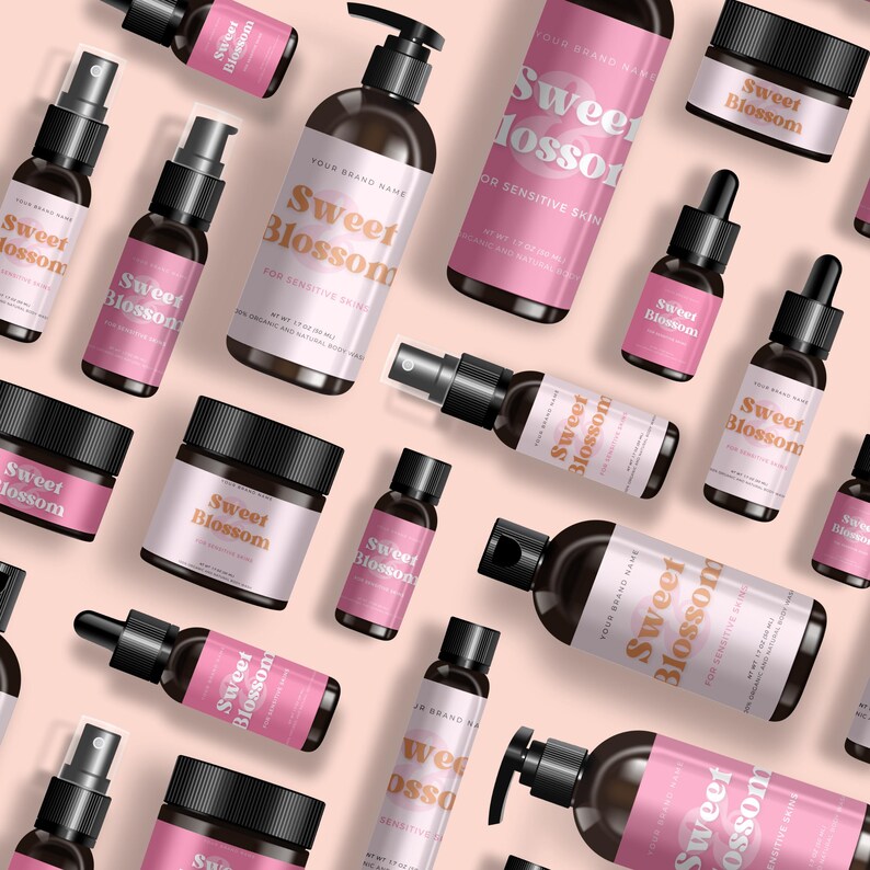 May include: A collection of dark amber skincare bottles and jars with black caps and pink labels featuring the text Sweet Blossom. The set includes pump bottles, spray bottles, dropper bottles, and cream jars arranged on a light pink background.