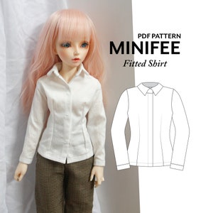May include: A white fitted shirt on a doll, with long sleeves and a collared neckline. The doll is wearing brown and black patterned pants. The image also includes a line drawing of the shirt and the text "PDF PATTERN MINIFEE Fitted Shirt."
