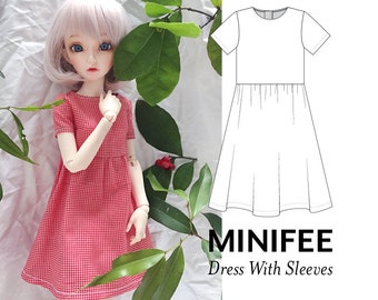 May include: A red and white gingham dress with short sleeves and a gathered skirt. A line drawing of the dress is shown next to the doll wearing the dress. The text "MINIFEE Dress With Sleeves" is below the drawing.