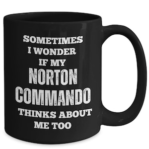May include: Black coffee mug with white text that reads "Sometimes I wonder if my Norton Commando thinks about me too."