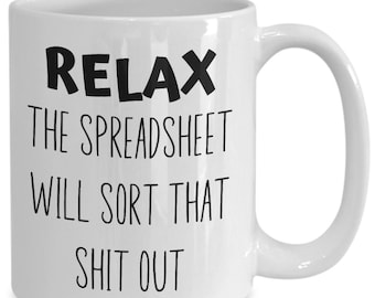 May include: White ceramic mug with the text "RELAX THE SPREADSHEET WILL SORT THAT SHIT OUT" in black, bold letters. The mug has a curved handle and a glossy finish, suitable for hot beverages.