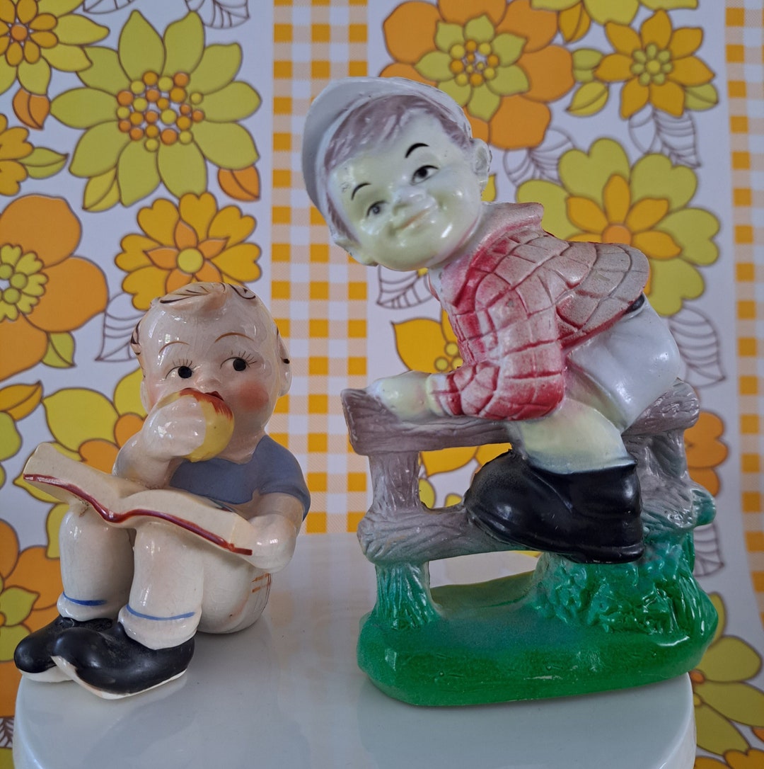 Vintage Boy Figurines. Boy on a Fence, Hong Kong Plastic. Ceramic