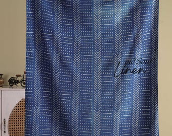 May include: A blue and white patterned textile with a fringe along the bottom edge. The fabric features a repeating design of white lines and dots against a deep blue background. The text "old soul linen" is visible.