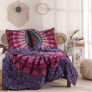May include: Purple and pink mandala patterned bedding set with two pillowcases. The bedding is made of soft cotton and features a beautiful mandala design.