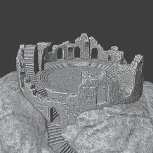 May include: A detailed grayscale model of a ruined amphitheater atop a rocky formation. The structure features arched openings, staircases, and a circular interior, evoking a sense of ancient architecture and history.