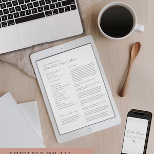 May include: A digital recipe card for chewy browned butter chocolate chip cookies. The recipe includes ingredients, directions, and a personal note section. The card is displayed on a tablet and a phone, both with a white background. The image also includes a laptop, a cup of coffee, and a wooden spoon.