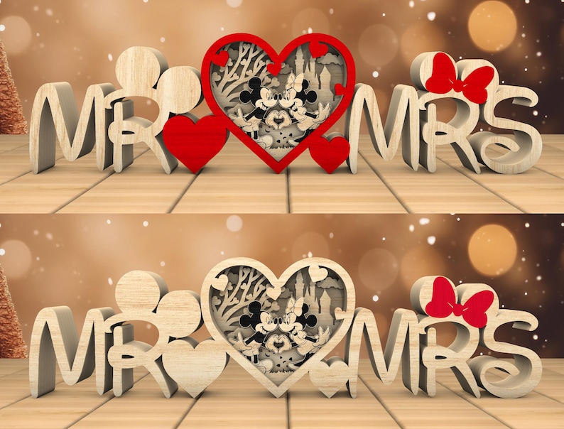 May include: Wooden cutout of "Mr." and "Mrs." with a heart-shaped design in the middle. The heart features a silhouette of Mickey and Minnie Mouse inside a castle.