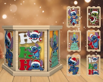 May include: A wooden lantern with a Christmas theme featuring Stitch from Lilo & Stitch. The lantern has a clear glass panel with images of Stitch wearing a Santa hat and saying "Ho Ho Ho". The lantern is surrounded by six smaller wooden panels with images of Stitch in various Christmas scenes.