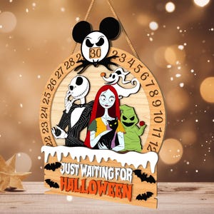 May include: Wooden Halloween countdown calendar featuring characters from The Nightmare Before Christmas. The design includes Jack Skellington, Sally, Zero, and Oogie Boogie. The text "Just Waiting for Halloween" is displayed below the characters.