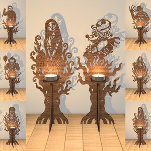 May include: A collection of brown wooden candle holders featuring intricate laser-cut silhouettes of various horror and fantasy characters. Each stand includes a small circular platform for a tea light candle, with detailed tree-like bases.