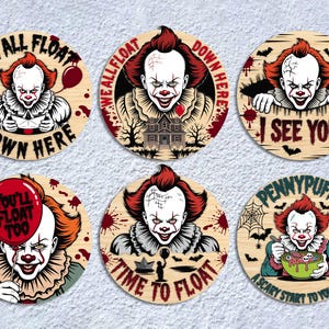 May include: Set of six wooden coasters featuring a scary clown design with red hair and makeup. Each coaster has a different phrase, including "We All Float Down Here" and "I See You". The coasters are round and have a light wood grain.