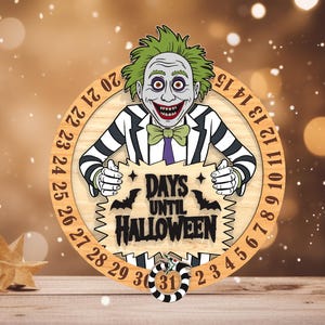 May include: Wooden Halloween countdown clock featuring a cartoon character with green hair and a black and white striped suit. The clock face has the text "DAYS UNTIL HALLOWEEN" and a rotating dial to count down the days.