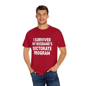 I Survived My Husband&#39;s Doctorate Program Unisex Garment-Dyed T-shirt | Funny Graduation Tee
