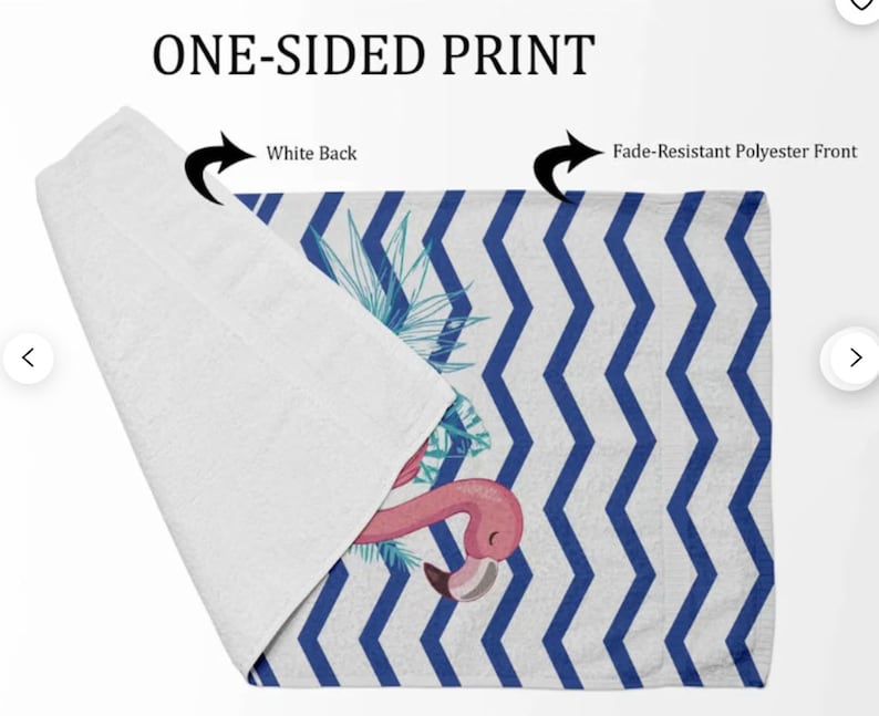 May include: One-sided beach towel with a white back and a blue and white chevron pattern on the front. The front also features a pink flamingo with tropical leaves.