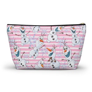 May include: Pink and white striped zippered pouch with a repeating pattern of Olaf the snowman from the movie Frozen. Olaf is smiling and has a carrot nose.