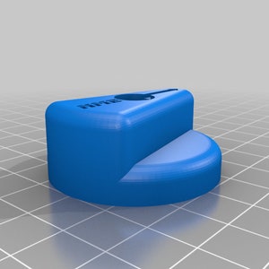 May include: A blue plastic knob with the word "HTFB" printed on it.