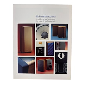May include: A vintage JBL Loudspeaker Systems advertisement featuring multiple product images of various wooden and black speakers, a close-up of a speaker cone, a control panel with a dial, and the text: JBL Loudspeaker Systems traditional craftsmanship for today's performances...