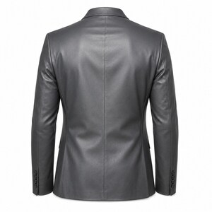 May include: A gray leather blazer with a classic design. The blazer features a notched lapel, two front pockets, and buttoned cuffs. The back of the blazer is visible, showcasing a tailored fit and a clean, minimalist aesthetic. The blazer is a versatile piece of outerwear.