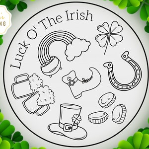 May include: Black and white line art illustration of Irish symbols including a pot of gold, a rainbow, a four-leaf clover, a horseshoe, a leprechaun's shoe, a pint of beer, a leprechaun's hat, and gold coins. The text "Luck O' The Irish" is written in a circle around the symbols.