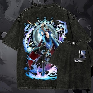 May include: A black acid-wash t-shirt featuring a large graphic of an anime character with blue hair holding a sword, surrounded by blue and purple energy effects. The front chest area displays a small rectangular print with the text RIMURU TEMPEST.