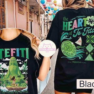 May include: Black t-shirt featuring the text "TEFITI" in green and pink, with a graphic of a green figure and a girl. The back of the shirt has the text "the HEART of Te Fiti" with Moana-themed graphics.