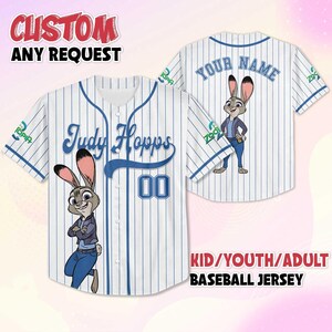 May include: White baseball jersey with blue pinstripes, featuring the name "Judy Hopps" and the number "00" on the front. The jersey also has a cartoon image of Judy Hopps. The back of the jersey has the text "YOUR NAME" and another Judy Hopps image.