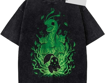 May include: A black acid-wash t-shirt featuring a large, vibrant green graphic print of a stylized creature with long antennae and a smaller, dark silhouette creature below, both surrounded by swirling green vines and leaves, with a white tag.